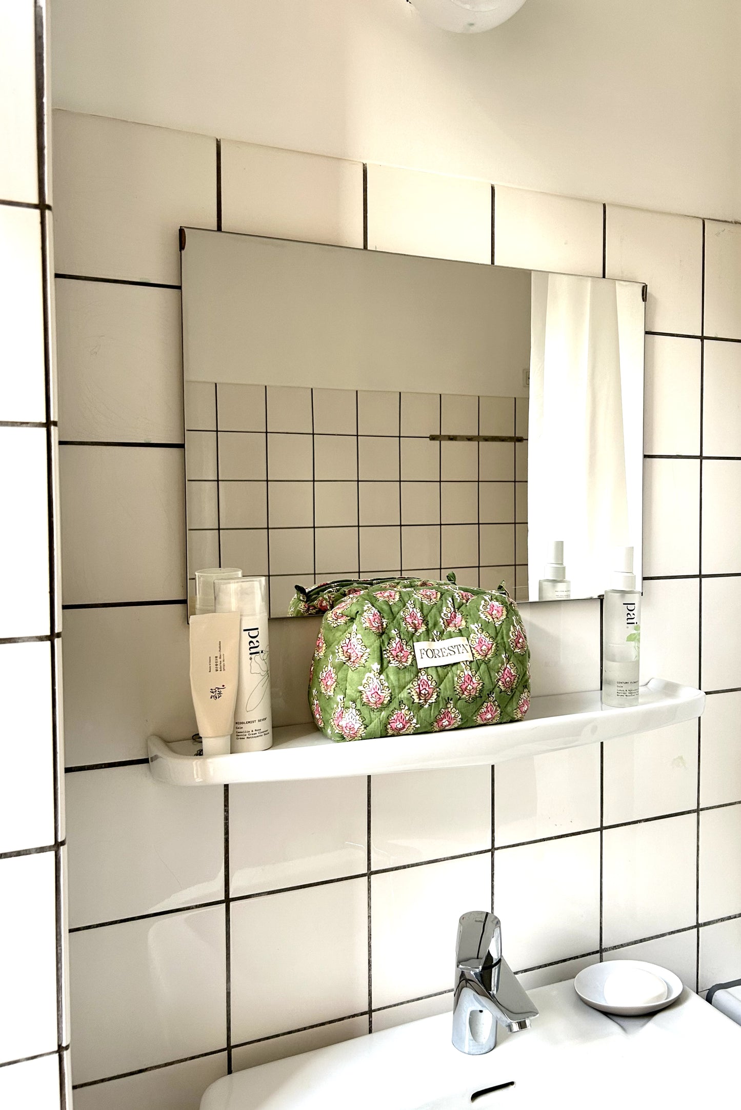 Green quilted makeup bag